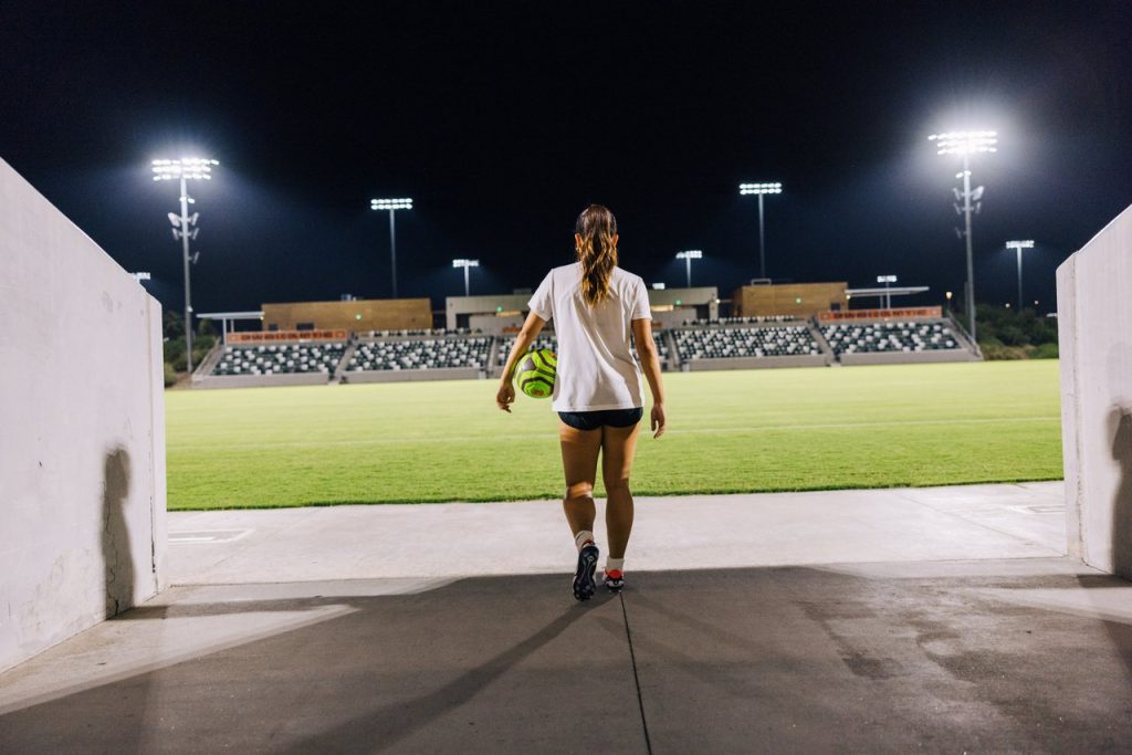 soccer player at great park sports complex at night