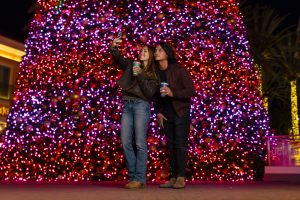 couple at irvine spectrum center christmas tree