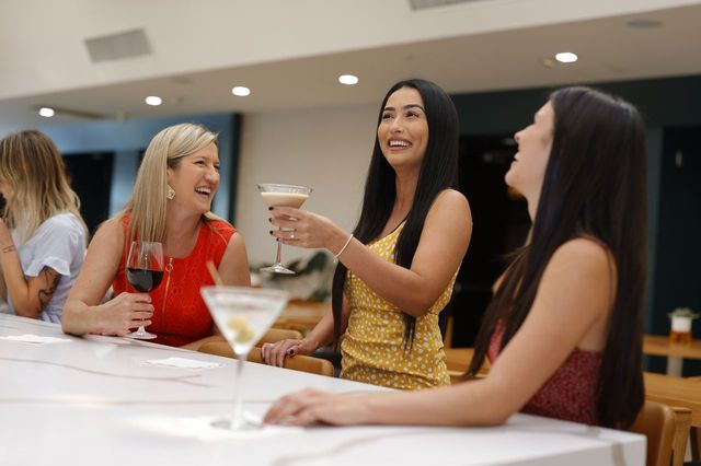 ladies having drinks at aura bar hilton irvine