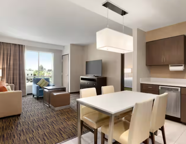 suite with kitchen and dining area at homewood suites irvine