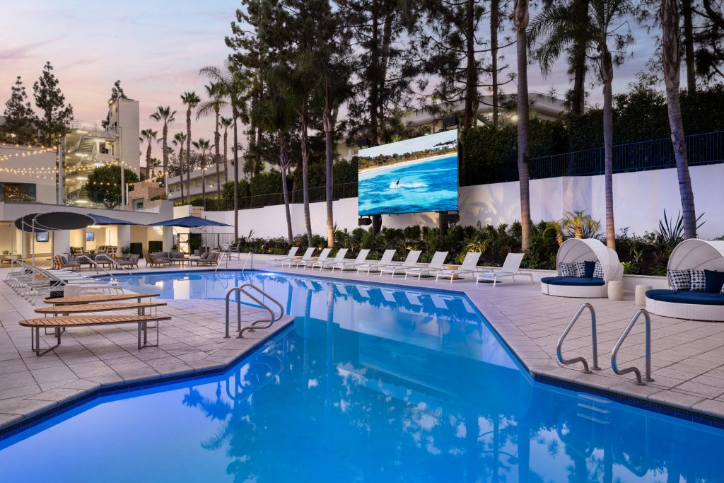 pool at night with jumbotron at irvine marriott