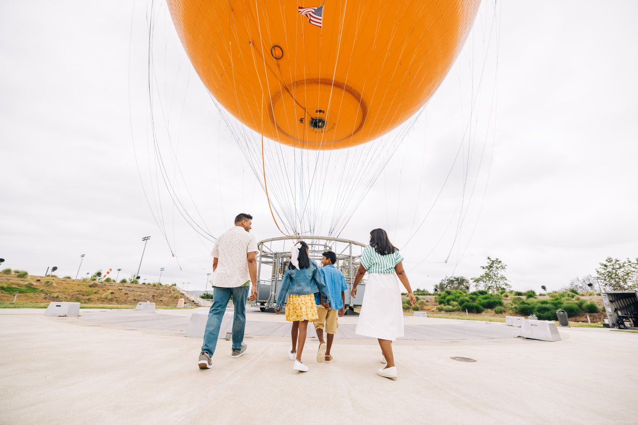 family entering great park balloon