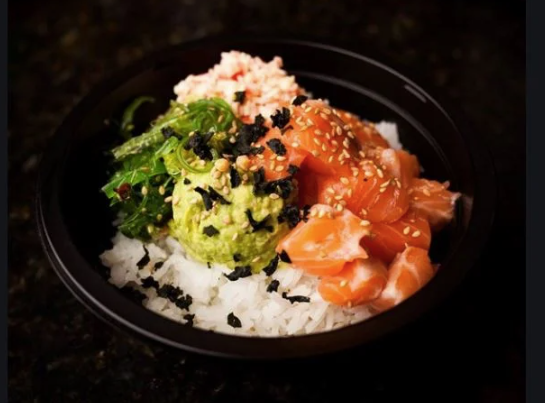 poke bowl with rice, sesame seeds, salmon and tuna at poke tiki