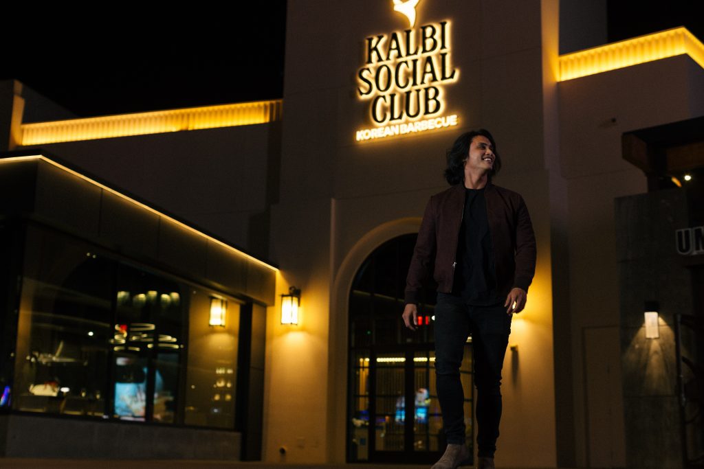 man outside kalbi social club restaurant at the spectrum