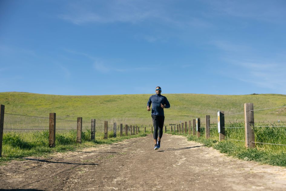 man in athletic attire running at quail hill trail in irvine